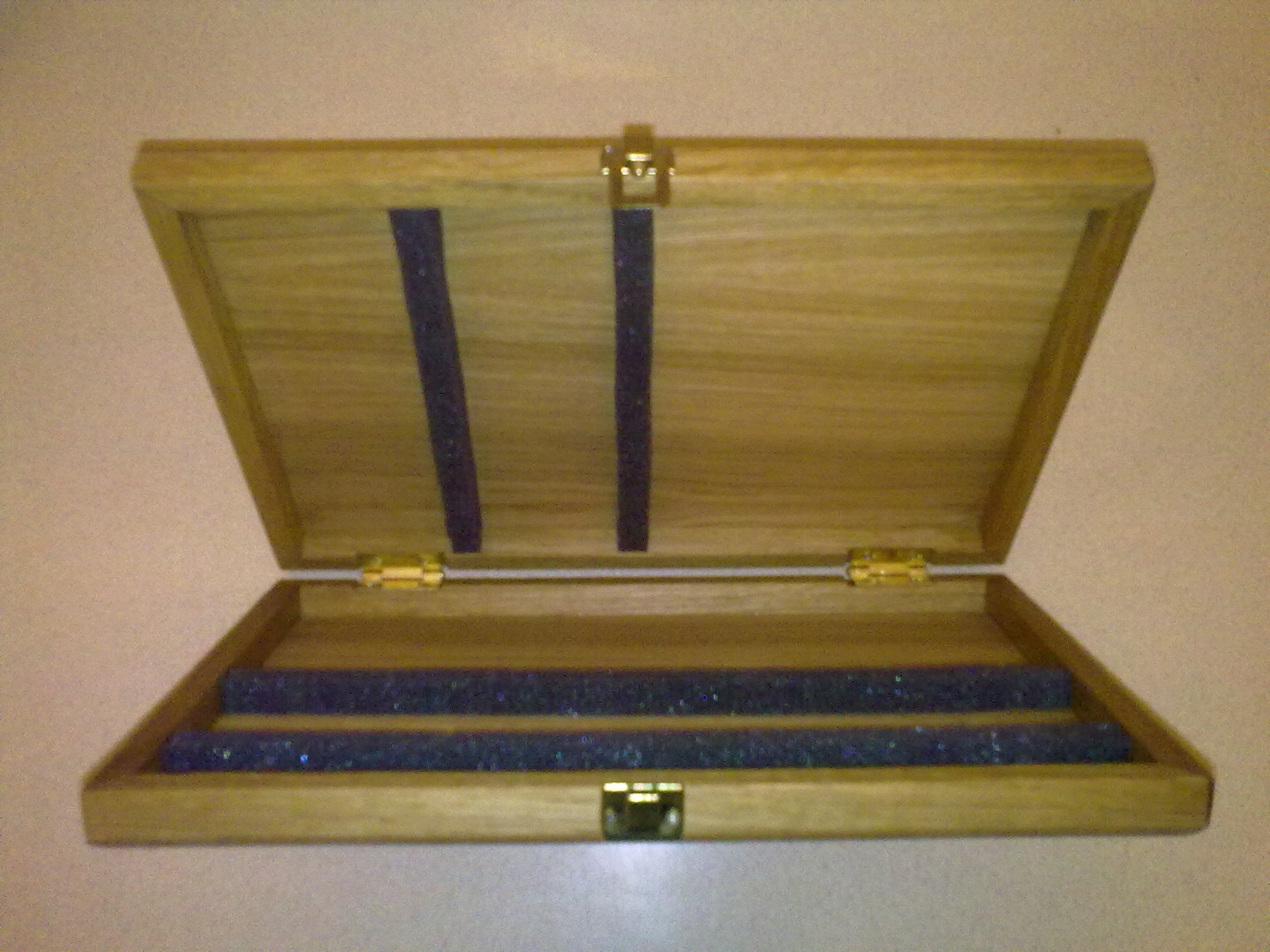 A hand made wooden fishing float box and hand made floats